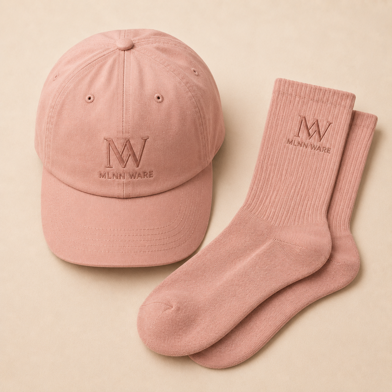 Pink cap and socks with a mlnn ware logo on a beige background